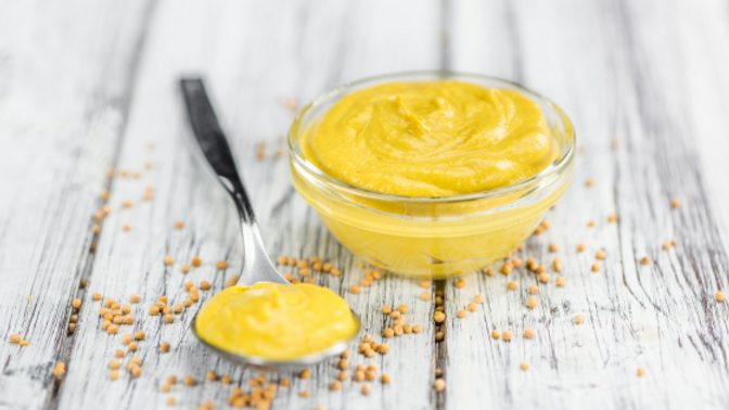 A small bowl of mustard, a staple of the mustard girl diet on tiktok